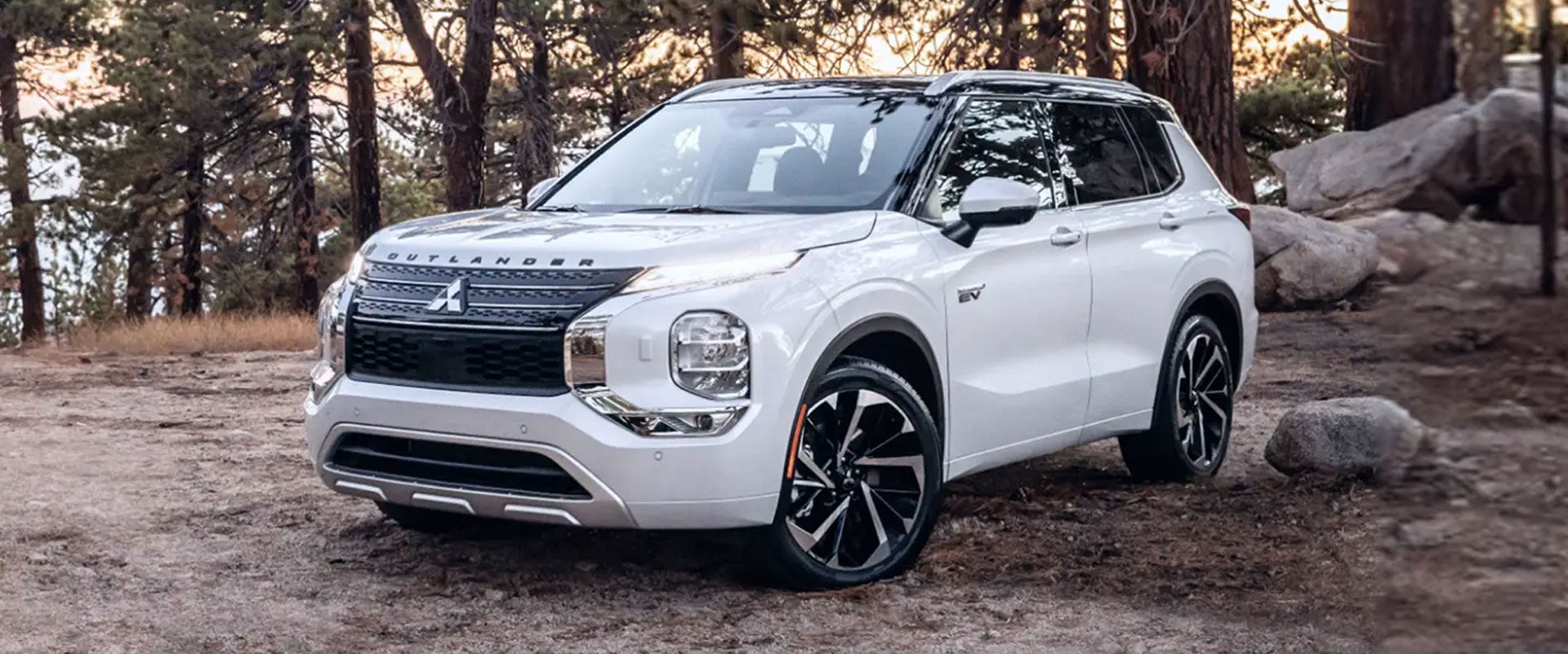 A white 2024 / 2025 Mitsubishi Outlander PHEV SUV